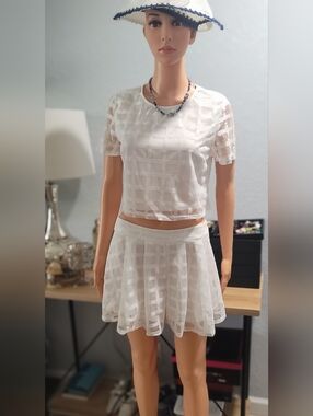 Miss Avenue White top and short skirt.